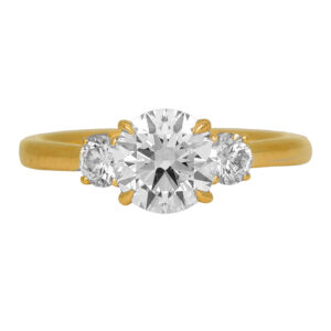New 14k yellow gold three stone engagement ring set with a 1.50 carat lab-grown round brilliant diamond plus 0.36 carats of lab-grown round brilliant diamonds.