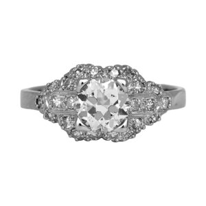 Antique platinum engagement ring set with a 0.97 carat old European cut earth-mined diamond plus 0.20 carats of single cut earth-mined diamonds.