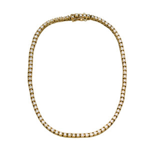 Vintage 14k yellow gold tennis bracelet set with 1.74 carats of round brilliant earth-mined diamonds.