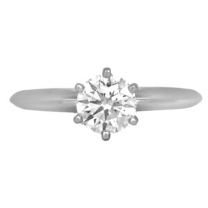 Vintage 14k white gold solitaire engagement ring set with a 0.83 carat round brilliant earth-mined diamond.