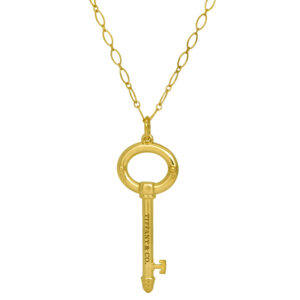Vintage 18k yellow gold Tiffany & Co. oval key pendant on an 18" link necklace.