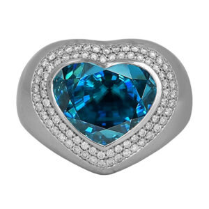 New 18k white gold heart halo ring set with a 9.20 carat heart blue zircon plus 0.50 carats of round brilliant earth-mined diamonds.