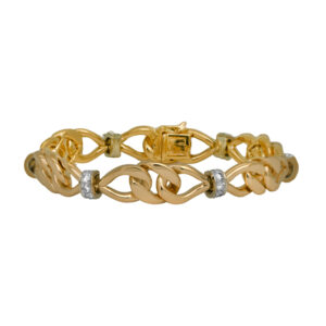 Vintage 18k yellow gold and platinum bow link bracelet set with 0.55 carats of round brilliant earth-mined diamonds.