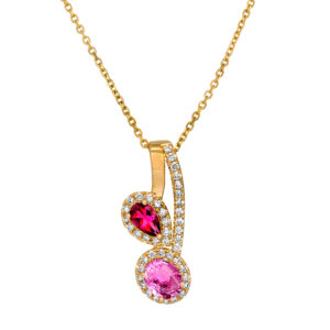 New 14k yellow gold halo pendant set with 0.75 carats of pear and oval pink sapphires and tourmalines plus 0.19 carats of round brilliant earth-mined diamonds on an 18" cable chain.