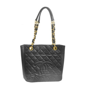 Vintage Chanel Petite Shopping black caviar leather tote with gold tone hardware.