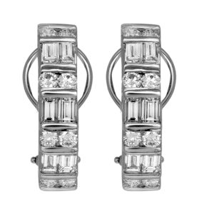Vintage 18k white gold earrings set with 2.00 carats of round brilliant and emerald cut earth-mined diamonds.