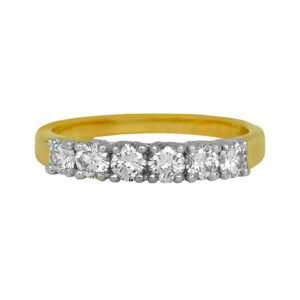 Vintage 14k yellow gold band set with 0.60 carats of round brilliant earth-mined diamonds.