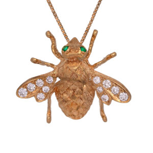 Vintage 18k yellow gold bee pendant set with 0.60 carats of round brilliant earth-mined diamonds plus emerald eyes. Shown on an 17.5″ 14k yellow gold box chain with a lobster clasp for $795; other lengths & styles available.