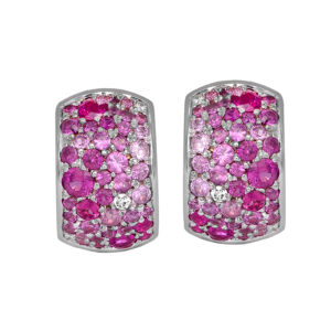 Vintage 18k white gold huggie hoop earrings set with 1.00 carats of round brilliant pink sapphires plus 0.06 carats of round brilliant earth-mined diamonds.