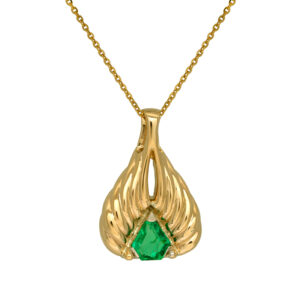 Vintage 14k yellow gold pendant set with a 0.75 carat shield earth-mined emerald. Shown on a 16" 14k yellow gold cable chain with a lobster clasp for $550; other lengths & styles available.