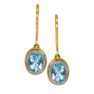 New 14k yellow & white gold earrings set with 1.48 carats of oval aquamarine.