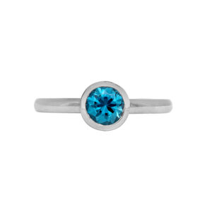 New 14k white gold solitaire ring set with a 1.20 carat round brilliant blue zircon.