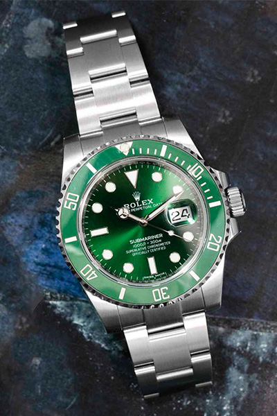 a close up image of a rolex submariner watch