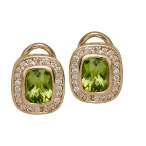 Vintage 14k yellow gold earrings set with 2.80 carats of cushion peridots plus 0.44 carats of round brilliant earth-mined diamonds in the haloes.