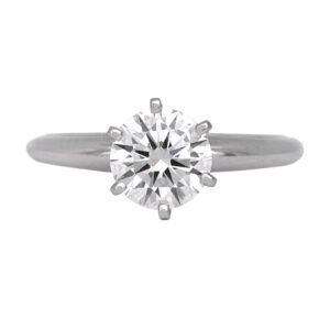 Vintage 14k white gold solitaire engagement ring set with a 0.94 carat round brilliant earth-mined diamond.