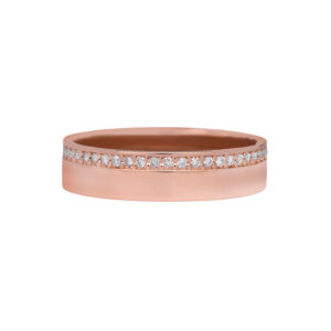 Vintage 14k rose gold eternity band set with 0.65 carats of round brilliant earth-mined diamonds.
