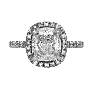 New platinum halo engagement ring set with a 3.01 carat cushion earth-mined diamond plus 0.51 carats of round brilliant earth-mined diamonds.