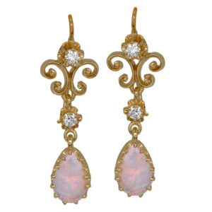 Vintage 14k yellow gold earrings set with pear opals plus 0.15 carats of round brilliant earth-mined diamonds.