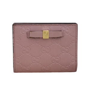 Vintage pink leather Gucci Guccissima bow wallet with dust cover and box.