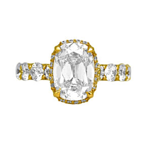 New 14k yellow gold halo engagement ring set with a 5.57 carats of lab-grown cushion cut diamond plus 2.43 carats of round brilliant lab-grown diamonds.