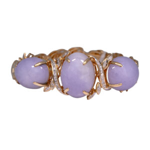 Vintage 18k yellow and white gold bracelet set with 60.00 carats of oval lavender jade plus 0.42 carats of round brilliant earth-mined diamonds.