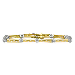 Vintage 14k yellow and white gold bracelet set with 2.25 carats of round brilliant earth-mined diamonds with safety chain.