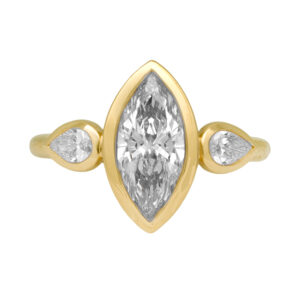 New 14k yellow gold three stone engagement ring set with a 2.01 carat marquise lab-grown diamond plus 0.41 carats of pear lab-grown diamonds.