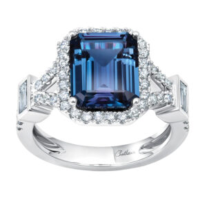 New 18k white gold Chatham halo ring set with a 3.77 carat emerald cut lab-grown alexandrite plus 0.67 carats of round brilliant and baguette lab-grown diamonds.