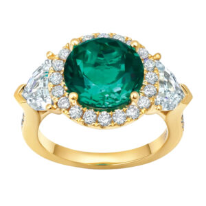 New 18k yellow gold Chatham halo ring set with a 2.67 carat round brilliant lab-grown emerald plus 2.35 carats of pentagon and round brilliant lab-grown diamonds.